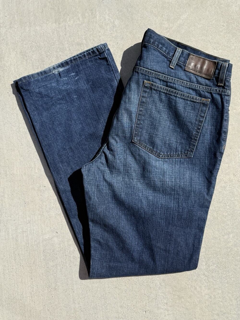 Calvin Klein Jeans Straight-Leg Indigo Denim With Brown Patch